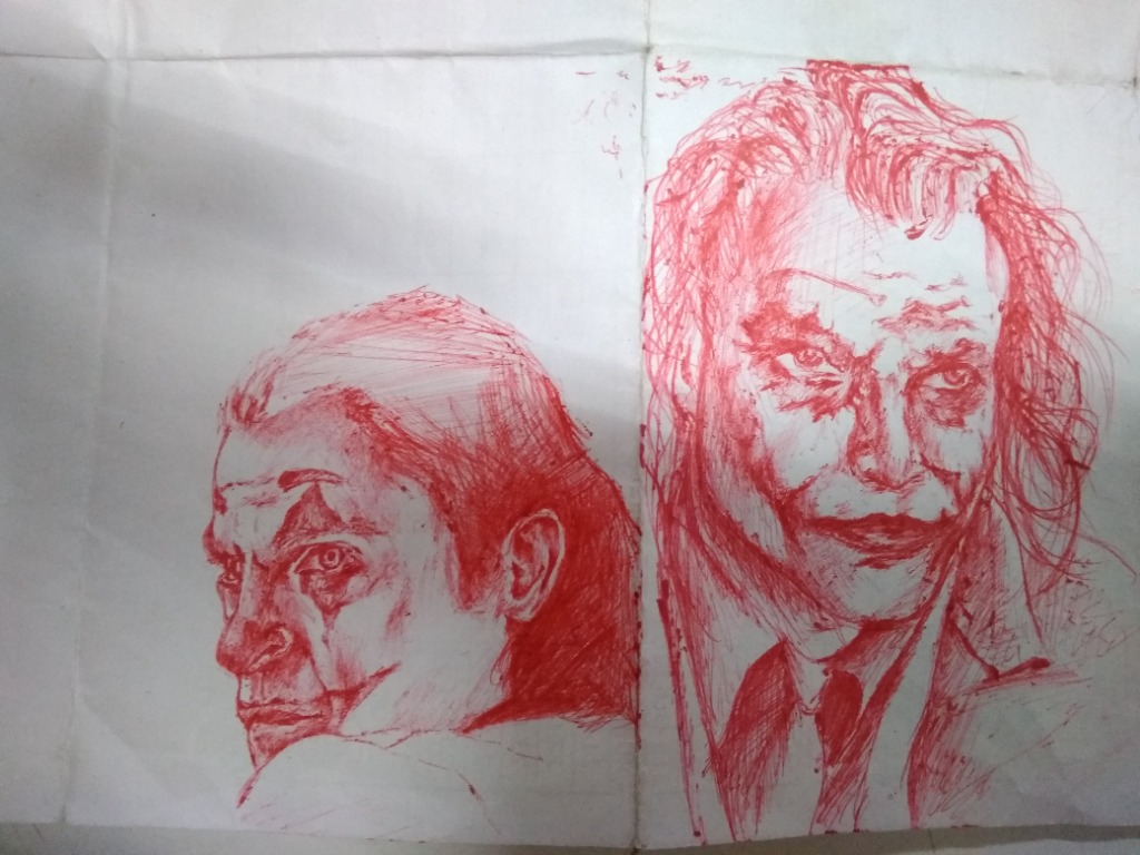 Red pen sketch studies of Joker